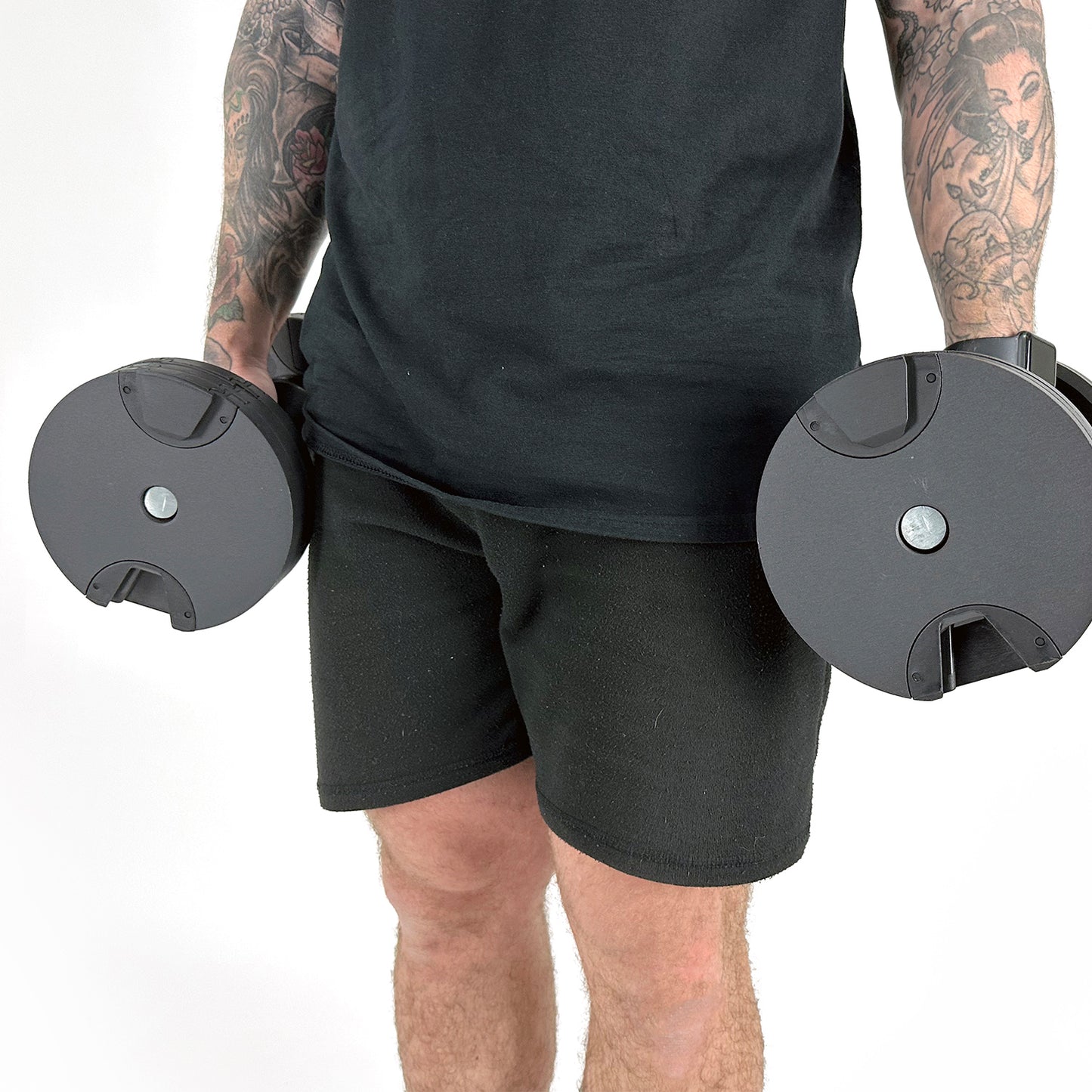 Fitness Model Using BRAINGAIN 40kg Round Adjustable Dumbbells Standing With Dumbbells By Side