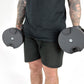 Fitness Model Using BRAINGAIN 45kg Round Adjustable Dumbbells Standing With Dumbbells By Side